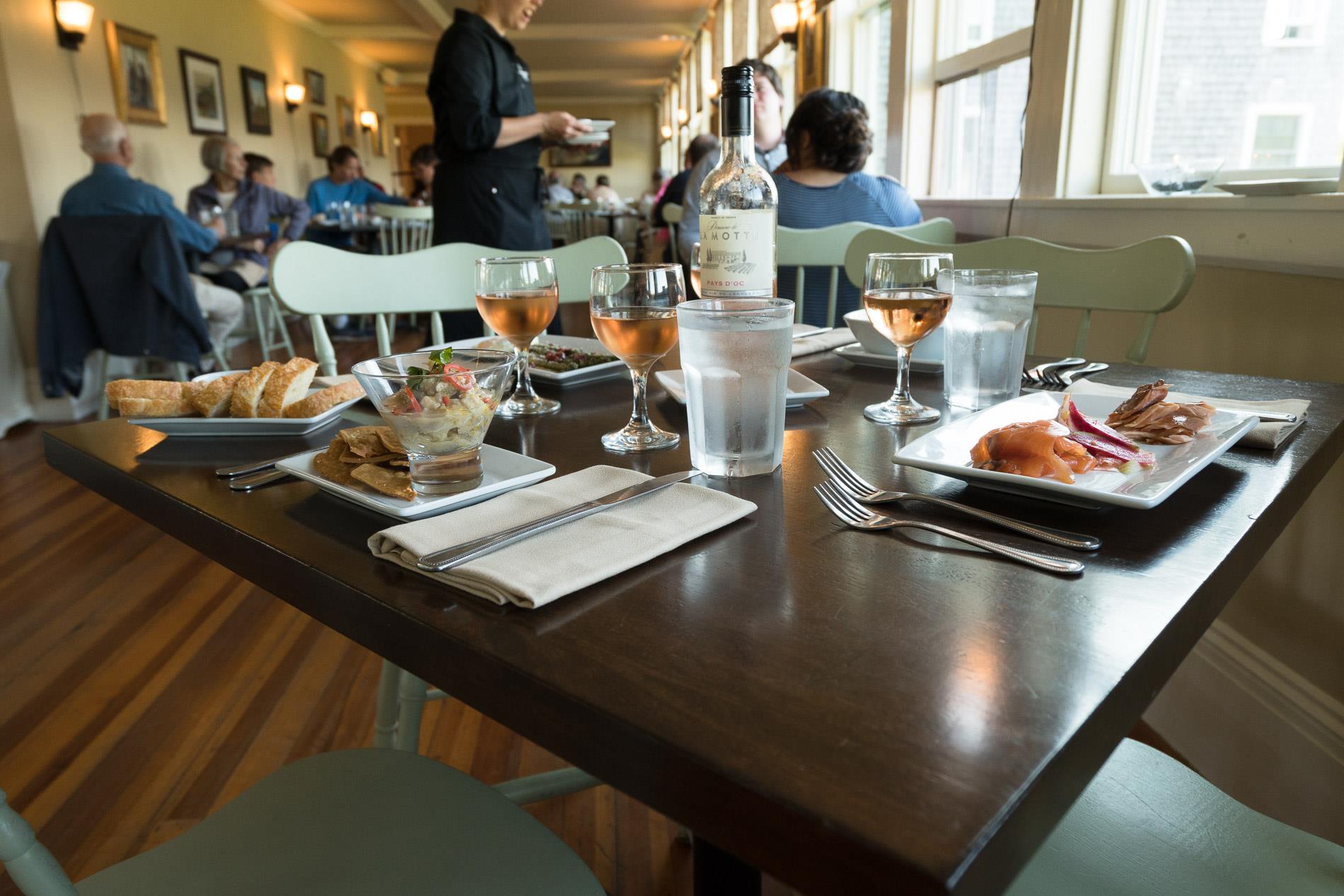 A table with plates of food in a restaurant